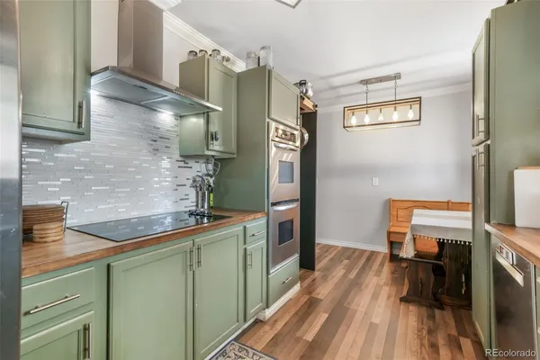 a bathroom with a granite countertop sink a toilet and mirror