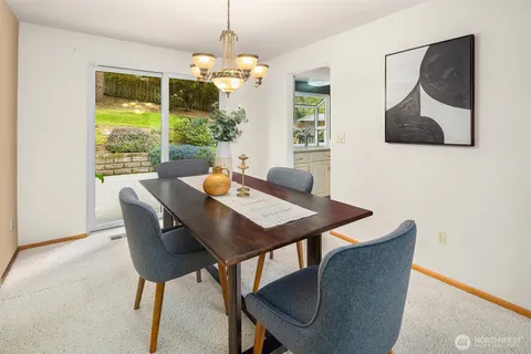 a view of a dining room with furniture window and outside view