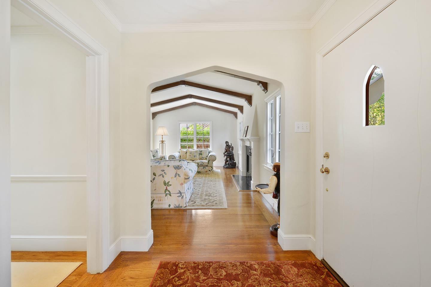 181 Warren Road San Mateo, CA 94401 - Photo 13 of 49 a view of a hallway view with wooden floor and a living room