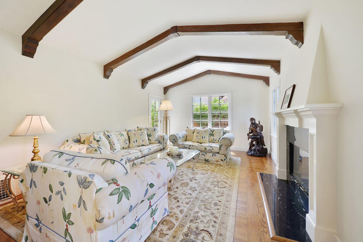 181 Warren Road San Mateo, CA 94401 - Photo 14 of 49 a living room with furniture and a fireplace