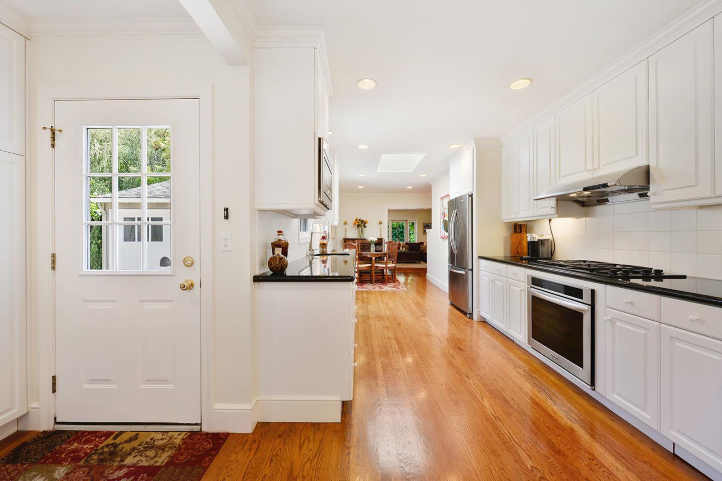 181 Warren Road San Mateo, CA 94401 - Photo 18 of 49 a kitchen with stainless steel appliances granite countertop a stove a sink and a refrigerator