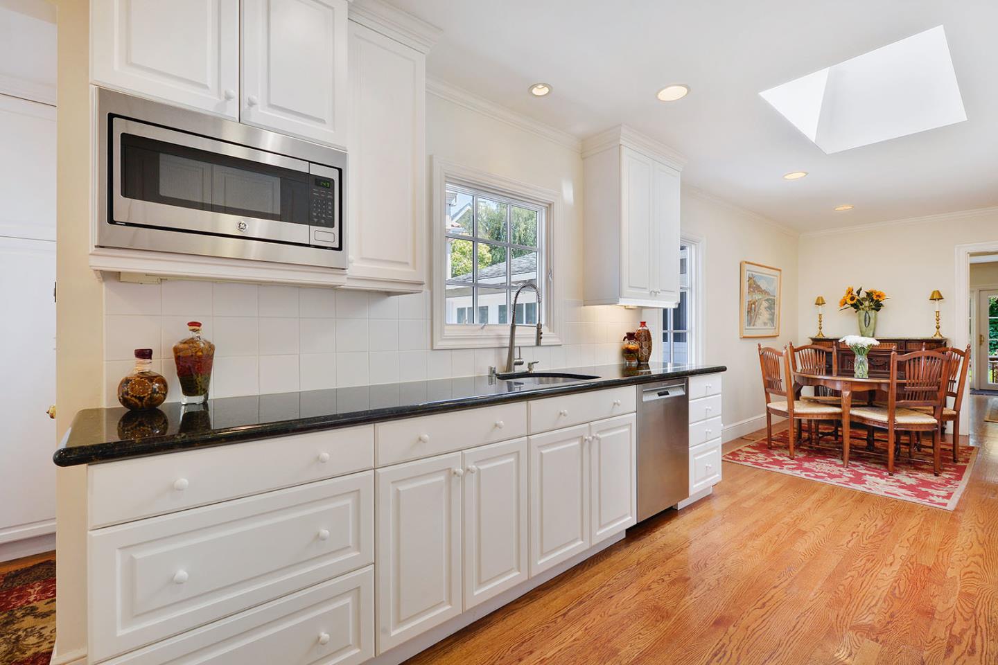 181 Warren Road San Mateo, CA 94401 - Photo 19 of 49 a kitchen with stainless steel appliances granite countertop a sink and cabinets