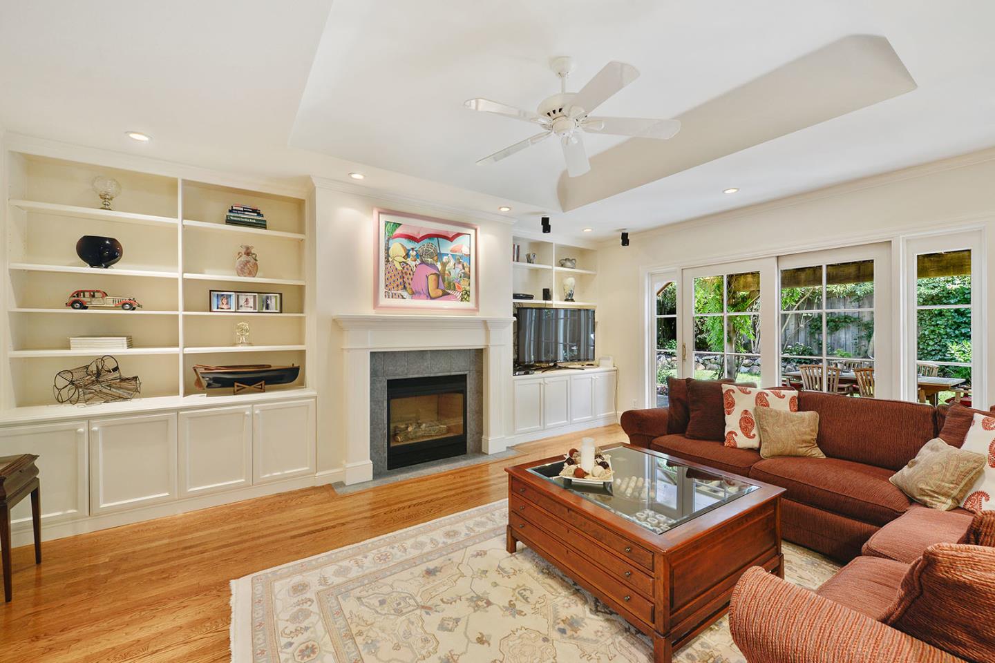 181 Warren Road San Mateo, CA 94401 - Photo 26 of 49 a living room with furniture a rug and a fireplace