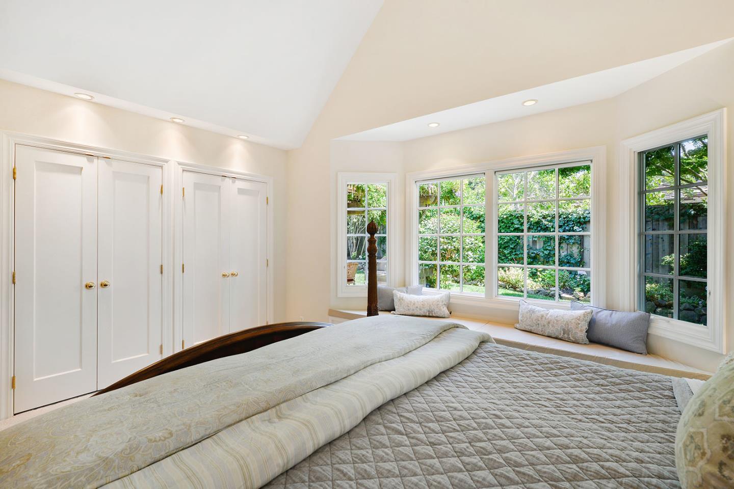 181 Warren Road San Mateo, CA 94401 - Photo 33 of 49 a bedroom with a large bed and a large window
