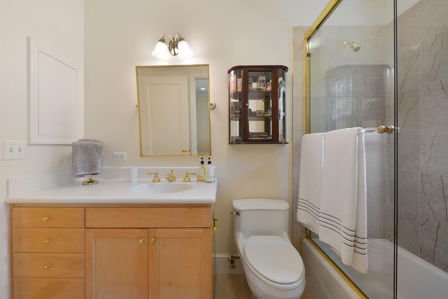181 Warren Road San Mateo, CA 94401 - Photo 38 of 49 a bathroom with a sink toilet and shower