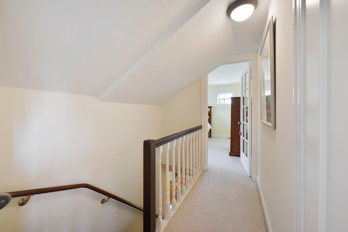 181 Warren Road San Mateo, CA 94401 - Photo 39 of 49 a view of a hallway with a white walls