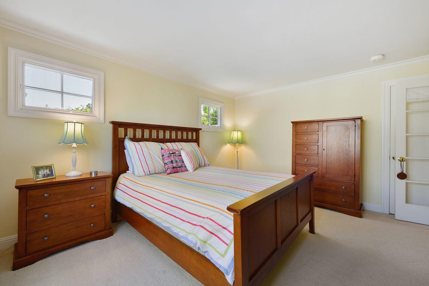 181 Warren Road San Mateo, CA 94401 - Photo 42 of 49 a bedroom with a bed and a dresser