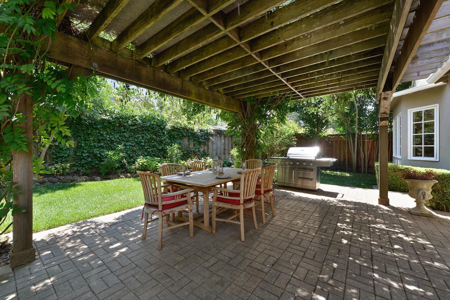 181 Warren Road San Mateo, CA 94401 - Photo 45 of 49 a patio with table and chairs and a barbeque
