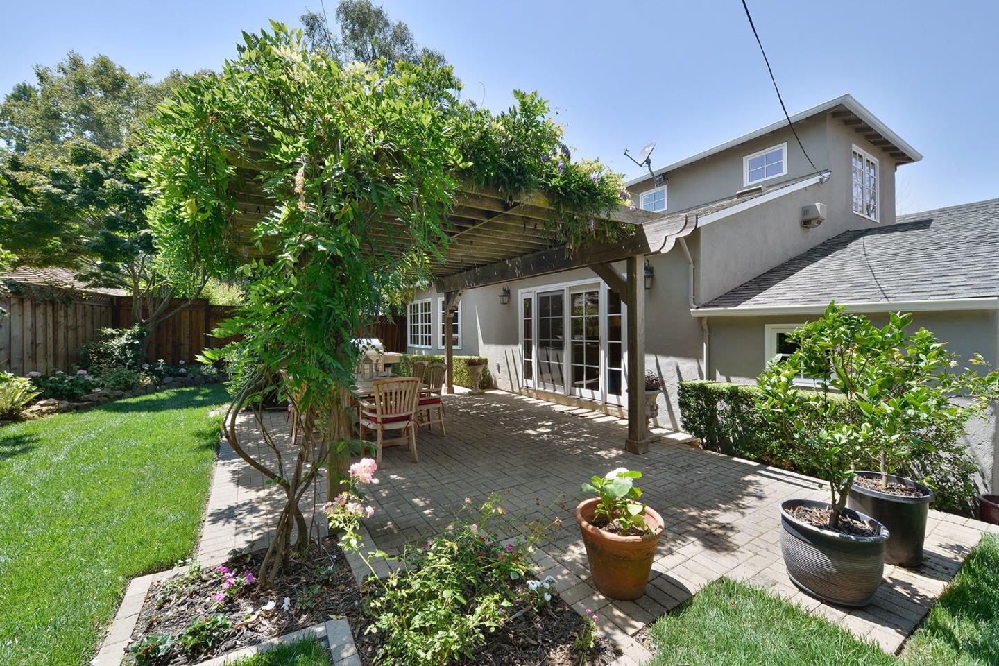 181 Warren Road San Mateo, CA 94401 - Photo 46 of 49 a view of a house with backyard sitting area and garden