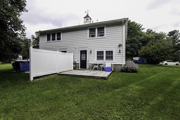 16 Radcliffe Road, Unit LEFT Billerica, MA 01821 - Photo 11 of 12 a front view of house with yard and green space