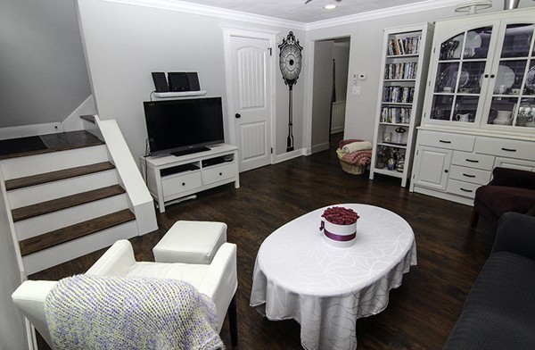16 Radcliffe Road, Unit LEFT Billerica, MA 01821 - Photo 4 of 12 a living room with furniture and a flat screen tv