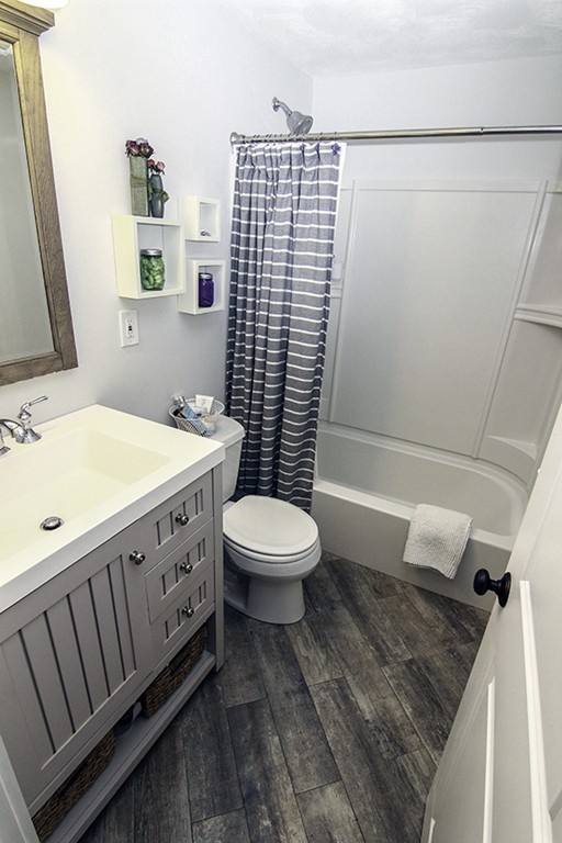 16 Radcliffe Road, Unit LEFT Billerica, MA 01821 - Photo 9 of 12 a bathroom with a granite countertop sink toilet and shower