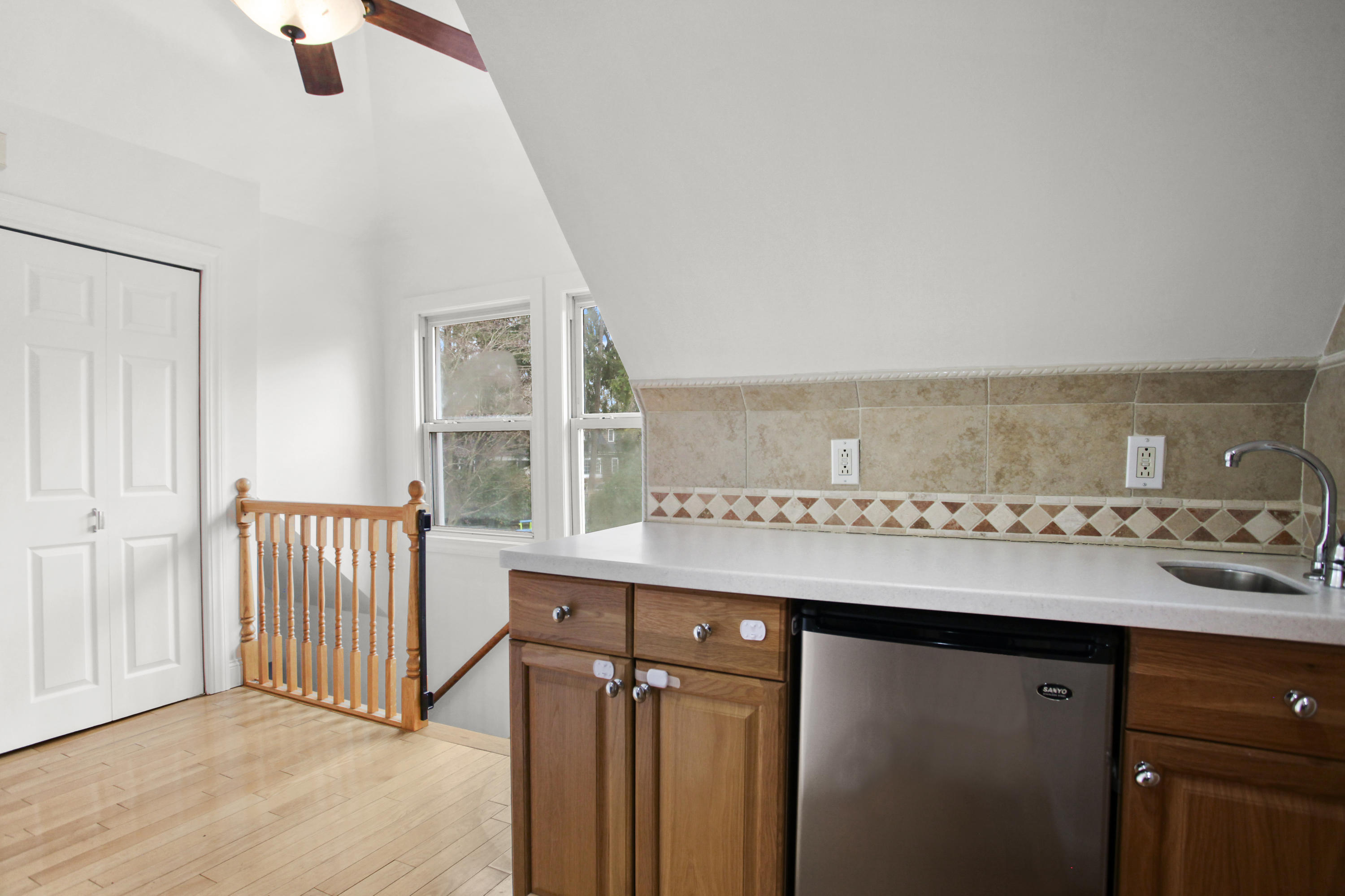 52 Bruce Park Drive, Unit B Greenwich, CT 06830 - Photo 12 of 20 a room with a sink cabinets and a window