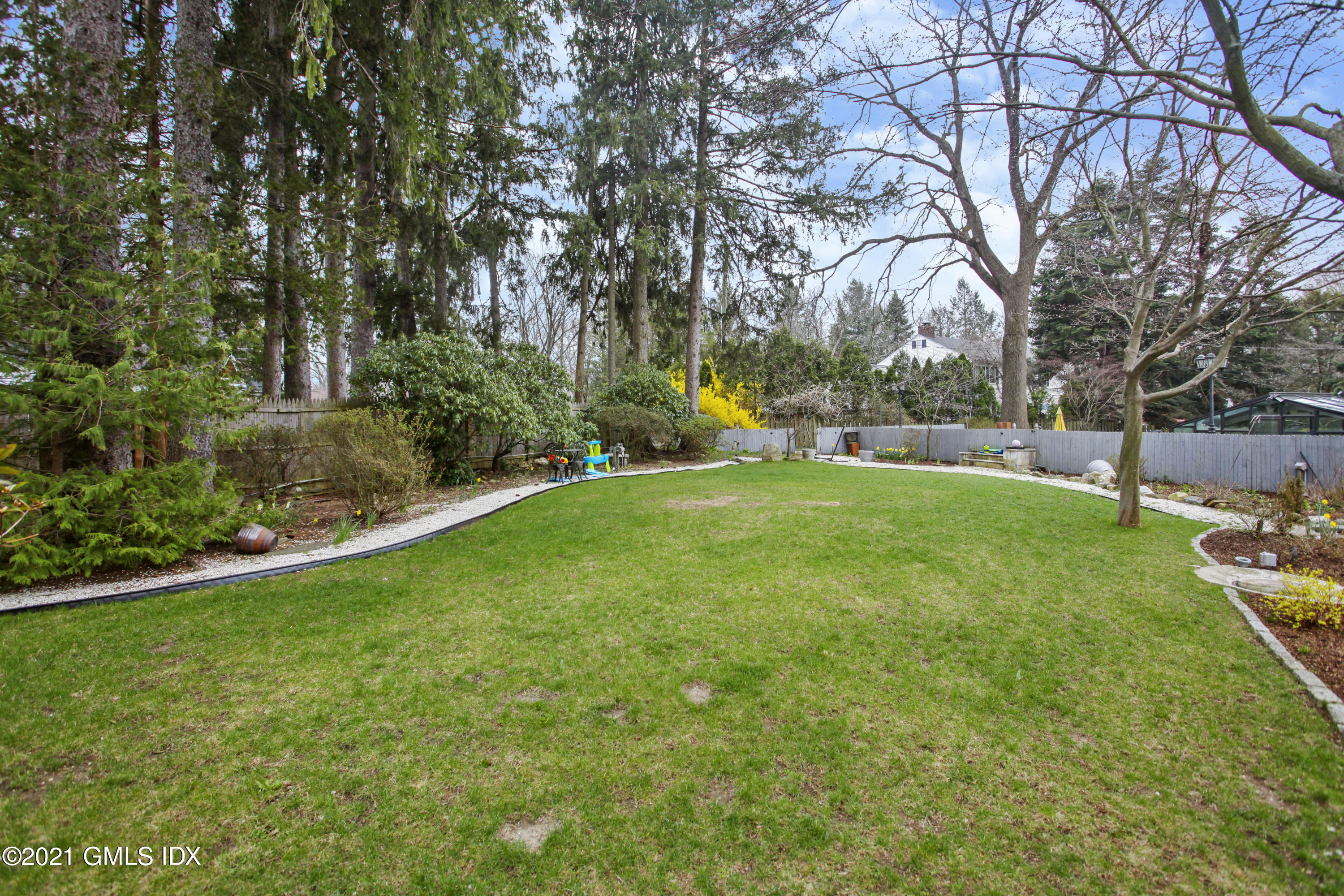 52 Bruce Park Drive, Unit B Greenwich, CT 06830 - Photo 19 of 20 a view of a park with large trees