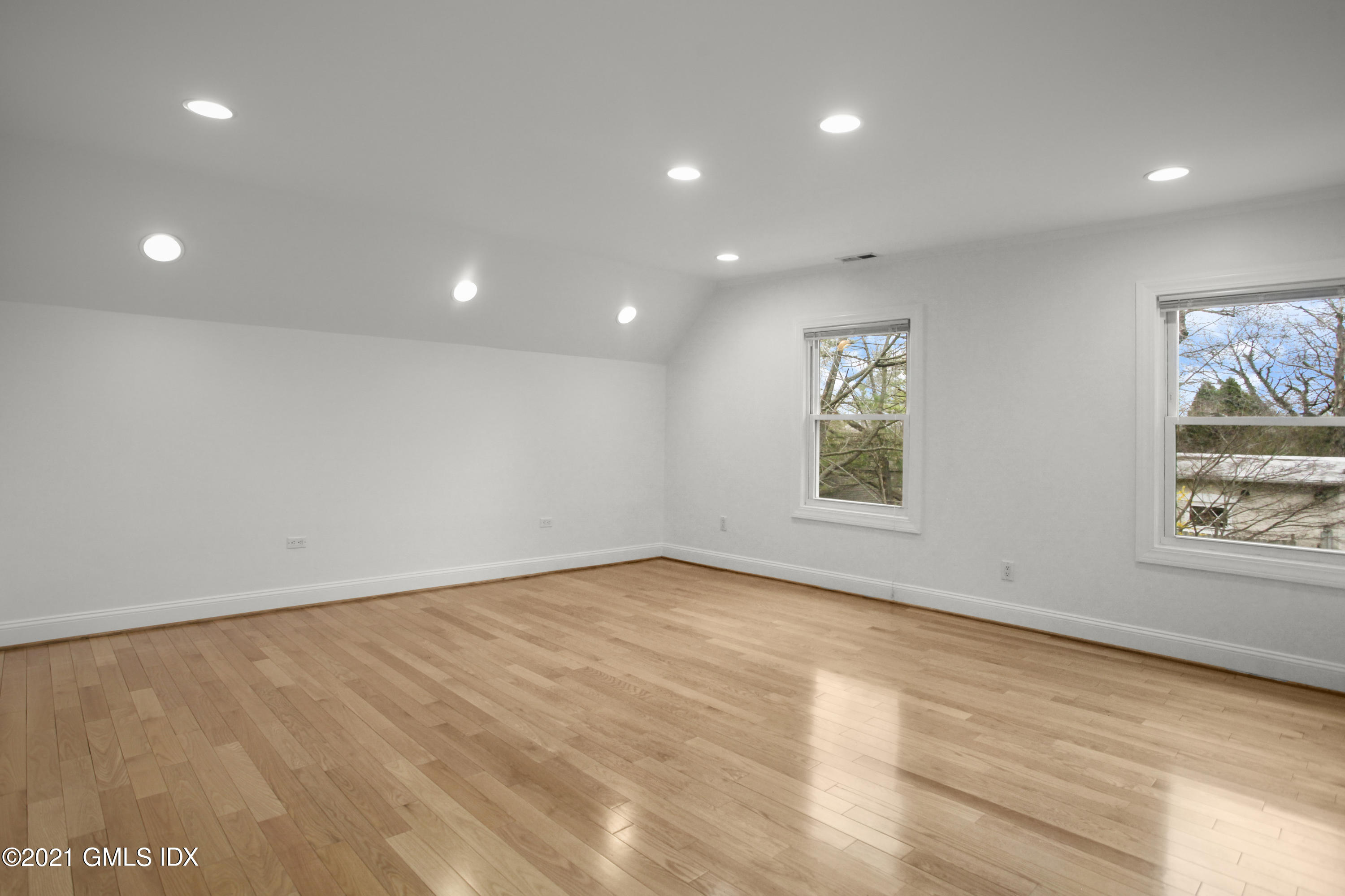 52 Bruce Park Drive, Unit B Greenwich, CT 06830 - Photo 7 of 20 an empty room with windows and closet
