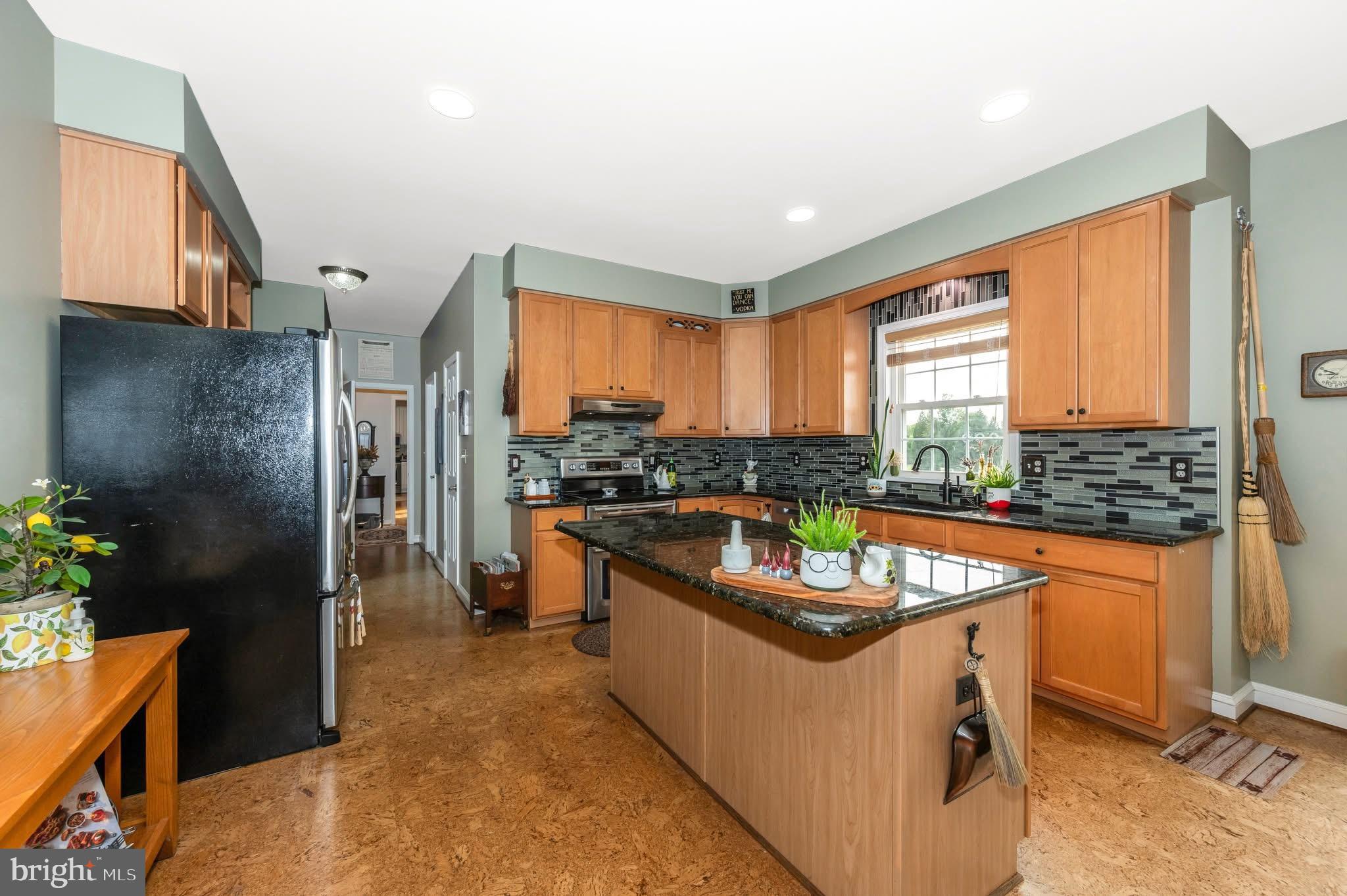 1280 St Michaels Road Mount Airy, MD 21771 - Photo 11 of 43 a kitchen with stainless steel appliances granite countertop sink stove and refrigerator