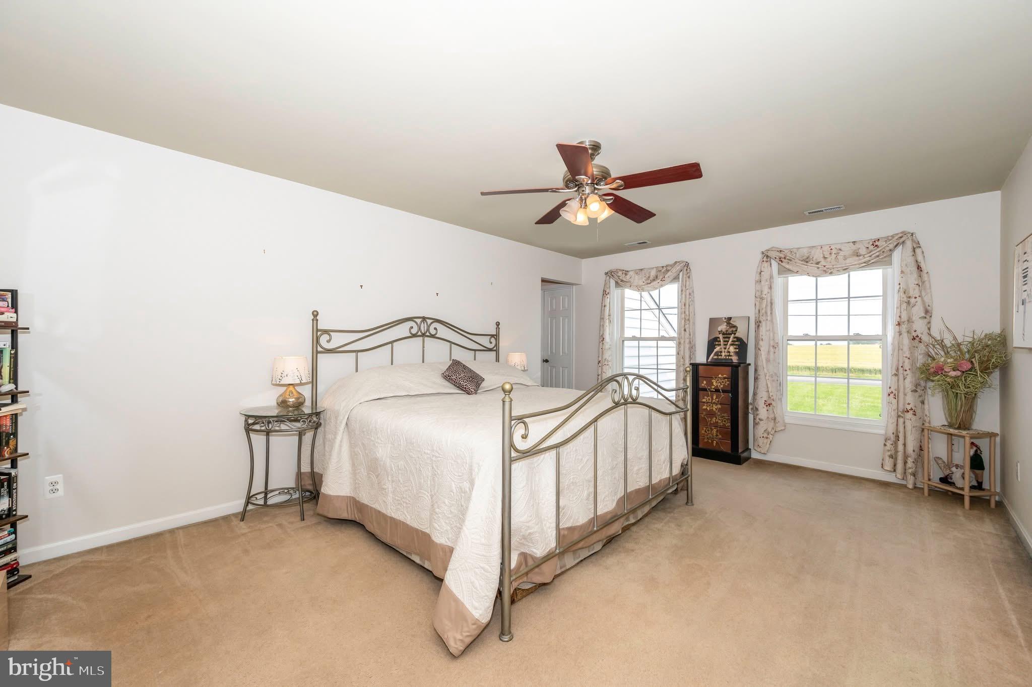 1280 St Michaels Road Mount Airy, MD 21771 - Photo 15 of 43 a bedroom with a bed chandelier and a window