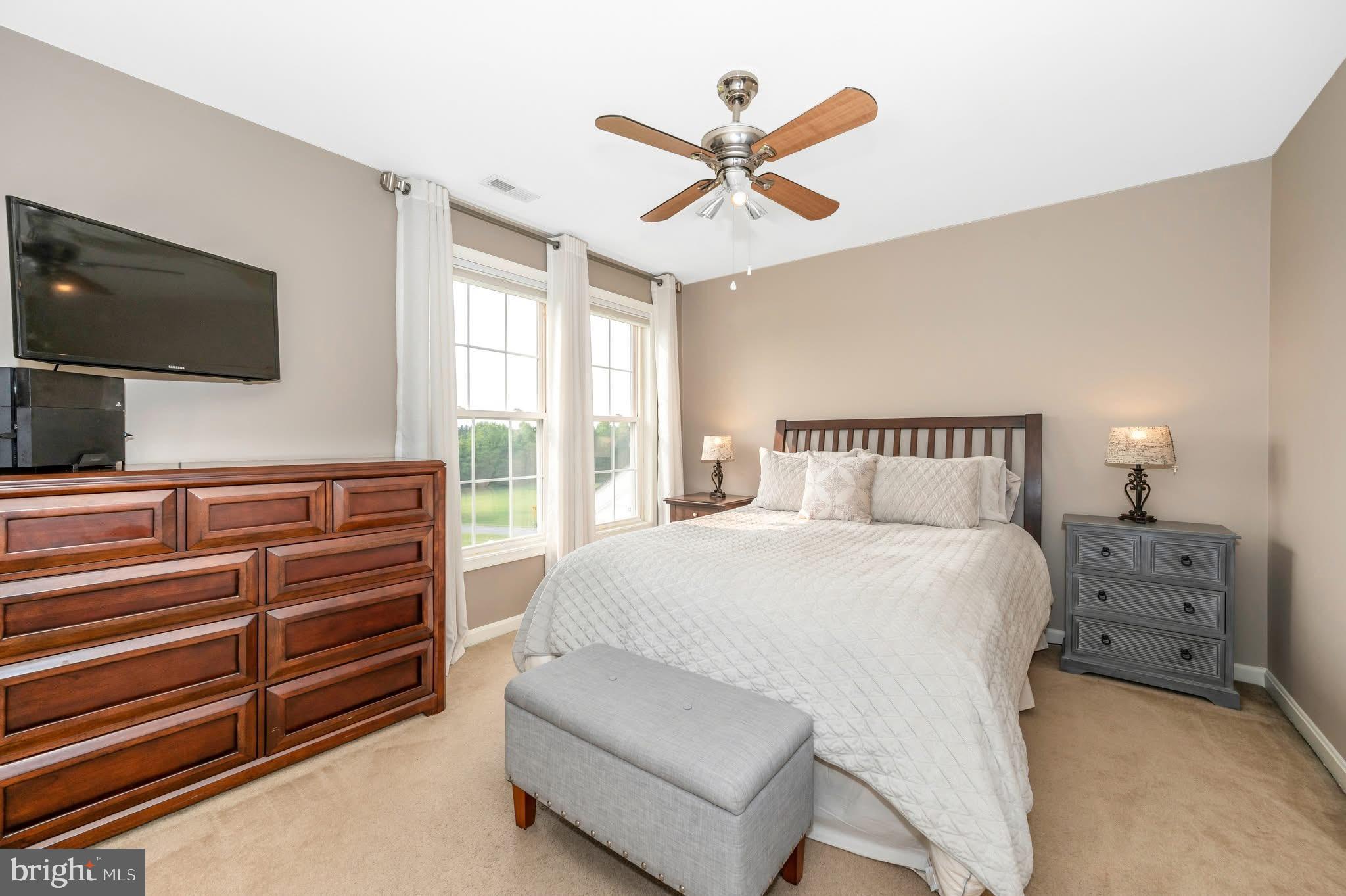 1280 St Michaels Road Mount Airy, MD 21771 - Photo 17 of 43 a bedroom with a bed and a flat screen tv