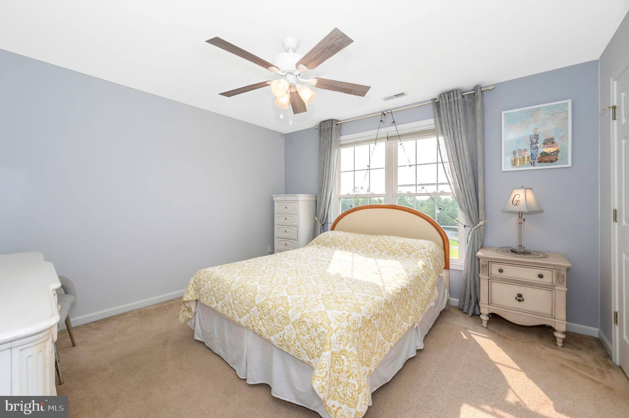 1280 St Michaels Road Mount Airy, MD 21771 - Photo 18 of 43 a bedroom with a bed and a chandelier