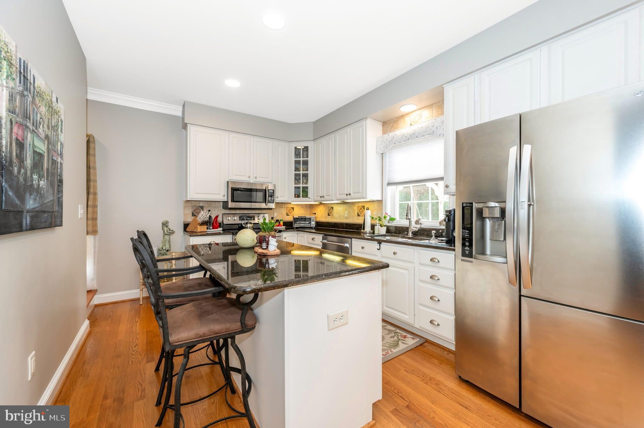 1280 St Michaels Road Mount Airy, MD 21771 - Photo 22 of 43 a kitchen with stainless steel appliances a refrigerator sink and cabinets