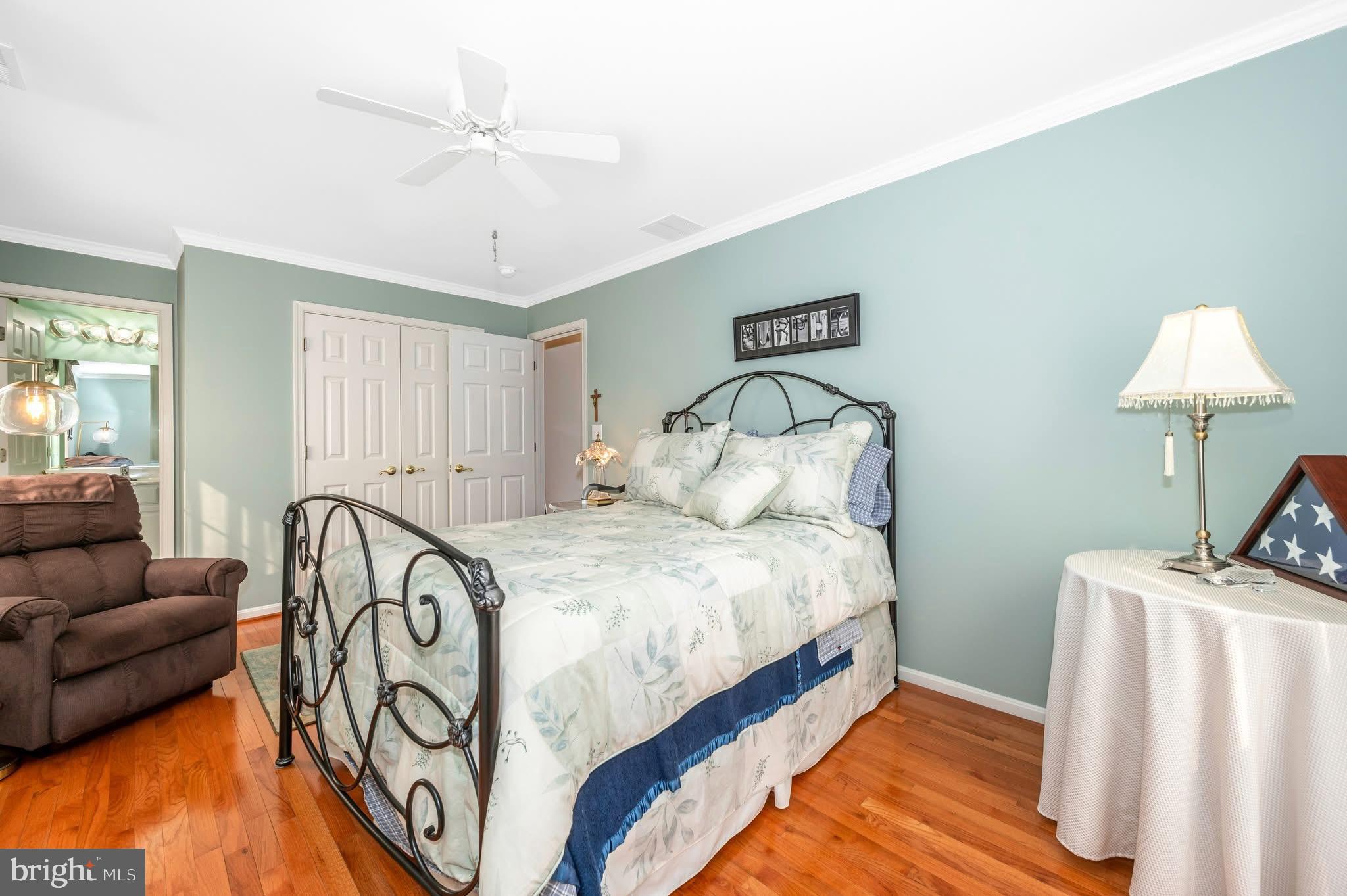 1280 St Michaels Road Mount Airy, MD 21771 - Photo 29 of 43 a spacious bedroom with a bed and a couch