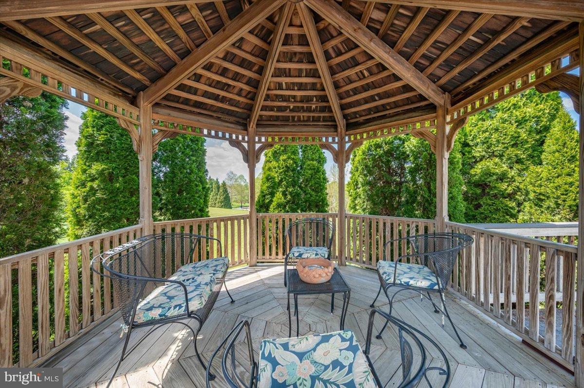 1280 St Michaels Road Mount Airy, MD 21771 - Photo 33 of 43 a roof deck with table and chairs and a barbeque