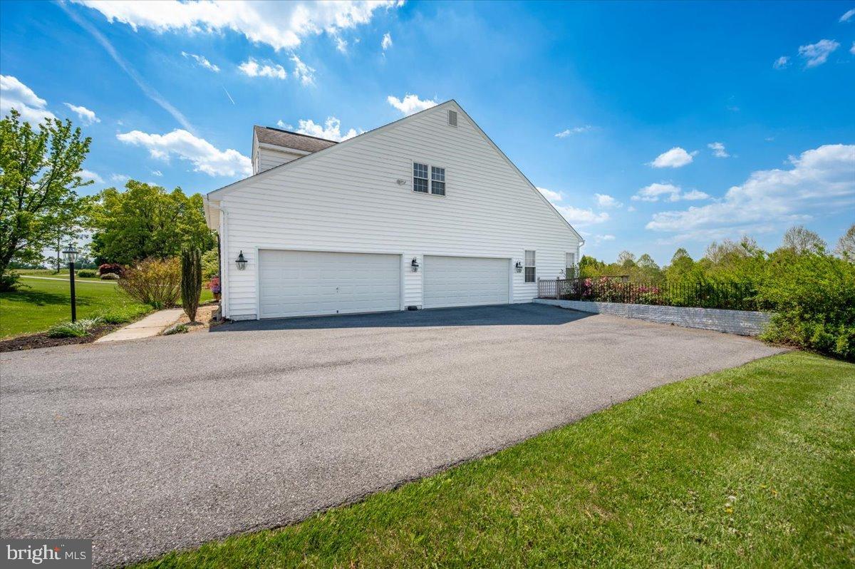 1280 St Michaels Road Mount Airy, MD 21771 - Photo 40 of 43 a front view of a house with a yard and garage