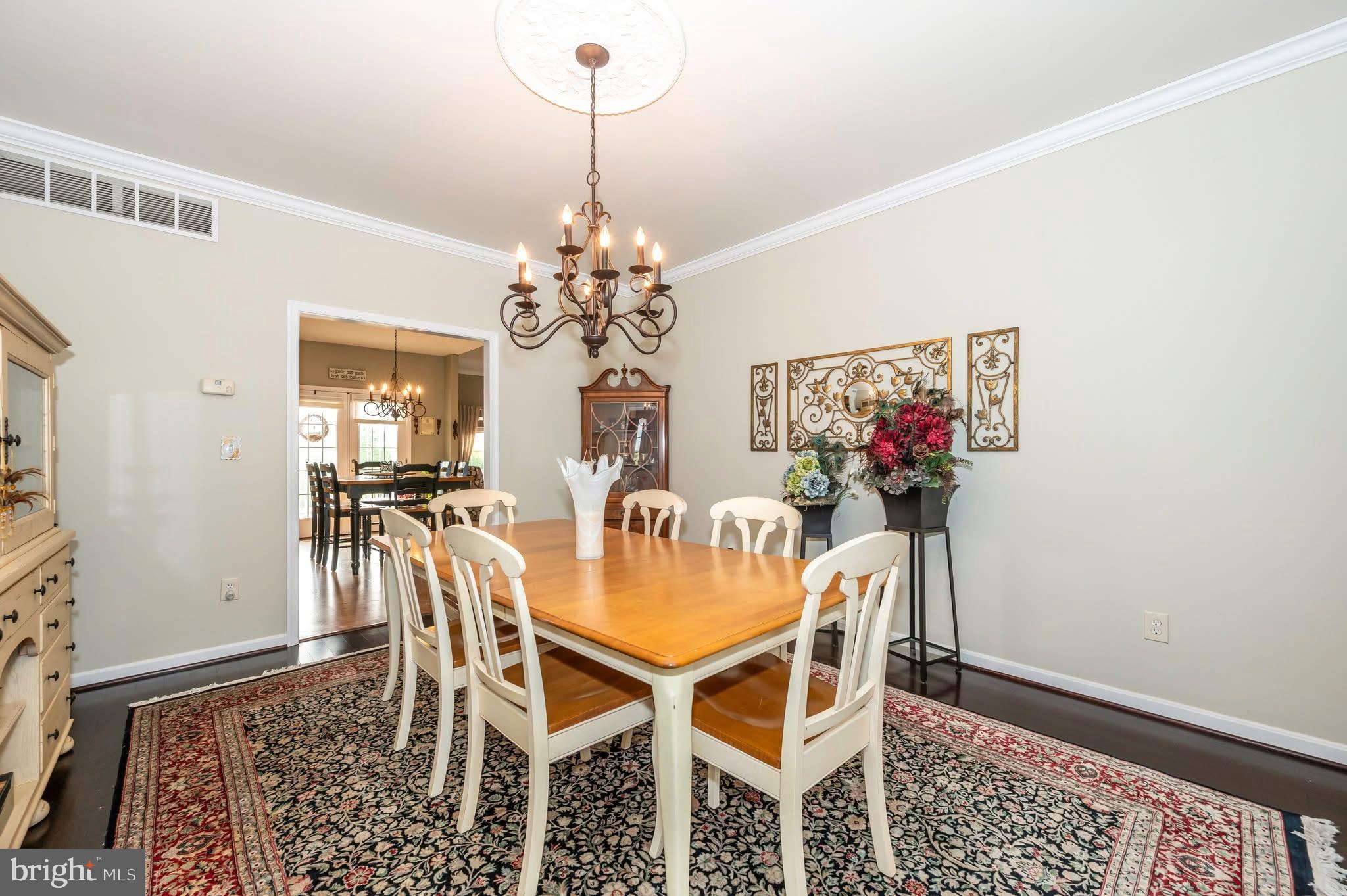 1280 St Michaels Road Mount Airy, MD 21771 - Photo 10 of 43 a view of a dining room with furniture and chandelier