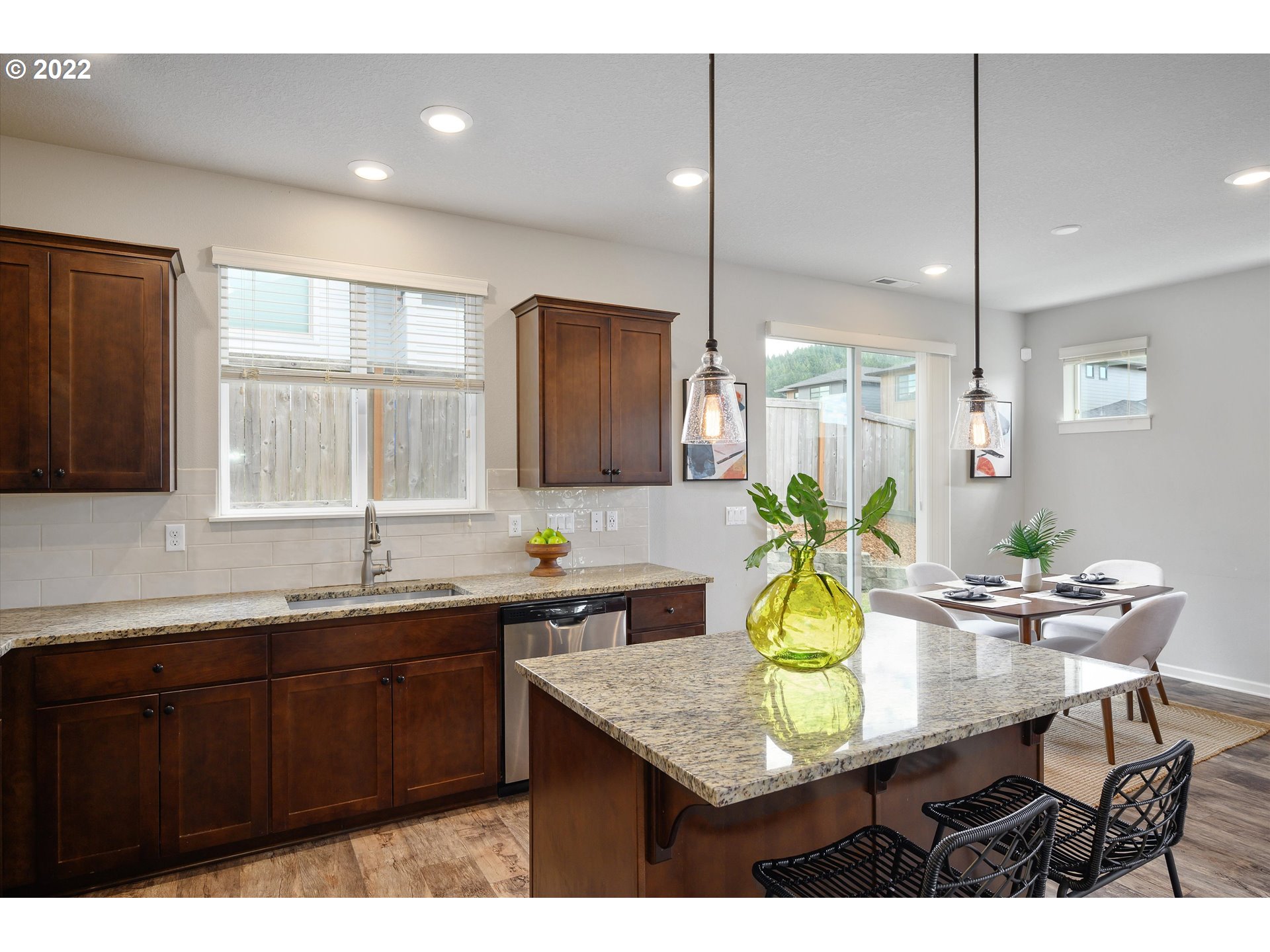 4288 Southwest Redfern Avenue Gresham, OR 97080 - Photo 12 of 32 a kitchen with a sink a counter cabinets and appliances