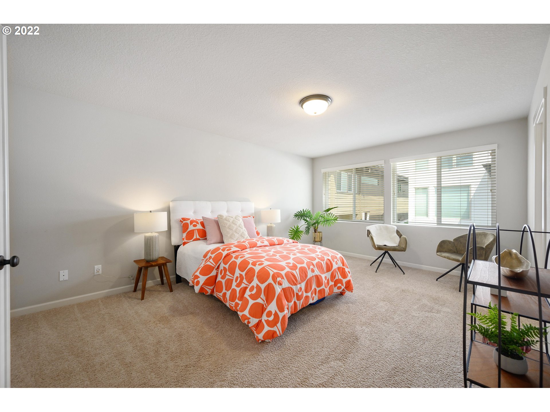 4288 Southwest Redfern Avenue Gresham, OR 97080 - Photo 19 of 32 a bedroom with a bed and lamp
