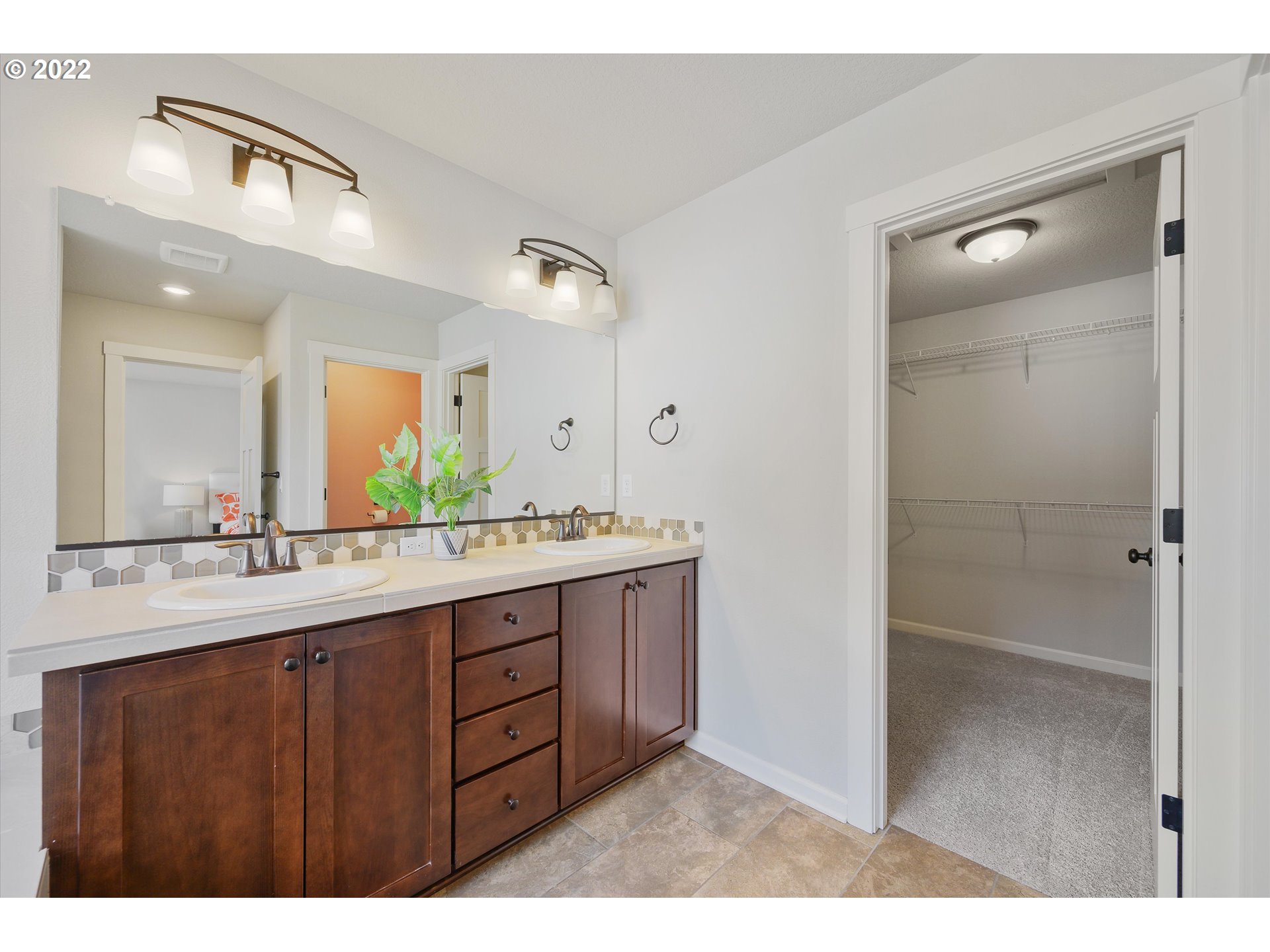 4288 Southwest Redfern Avenue Gresham, OR 97080 - Photo 21 of 32 a bathroom with a granite countertop sink mirror and double