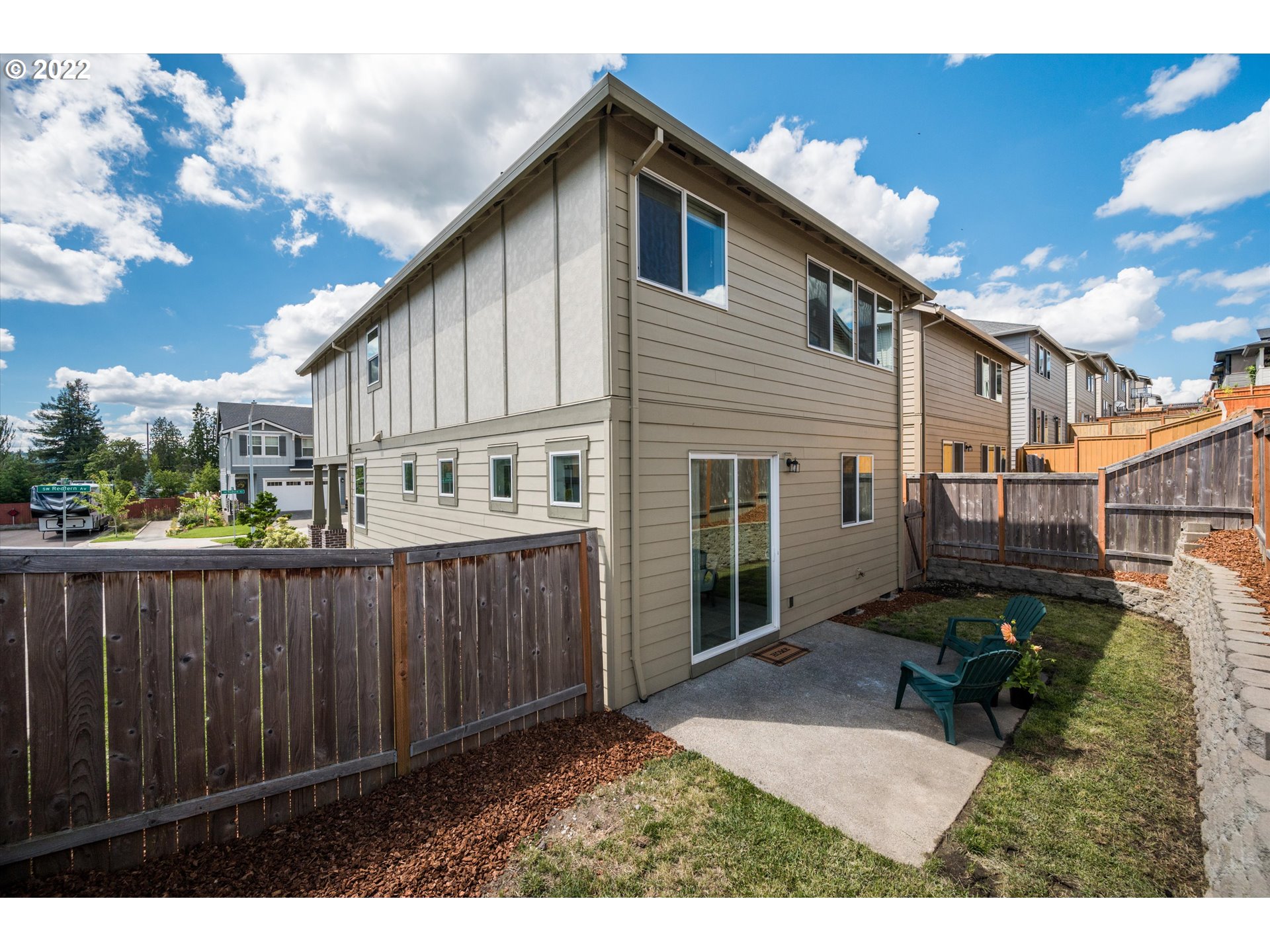 4288 Southwest Redfern Avenue Gresham, OR 97080 - Photo 27 of 32 a backyard of a house with table and chairs
