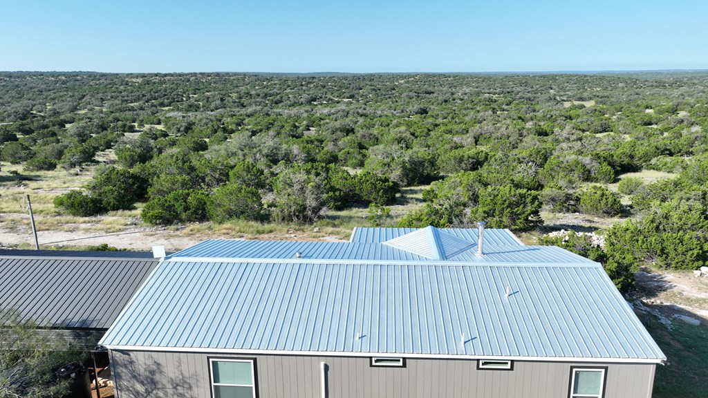 Lot 1 Rr 674 Rocksprings, TX 78880 - Photo 13 of 16 a view of a balcony with wooden floor and fence