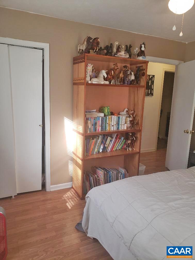 2965 Redd Shop Road Farmville, VA 23901 - Photo 8 of 16 a bed sitting in a bedroom next to a window