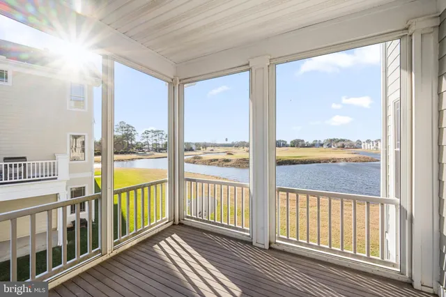 a view of a kitchen with a sink and cabinets