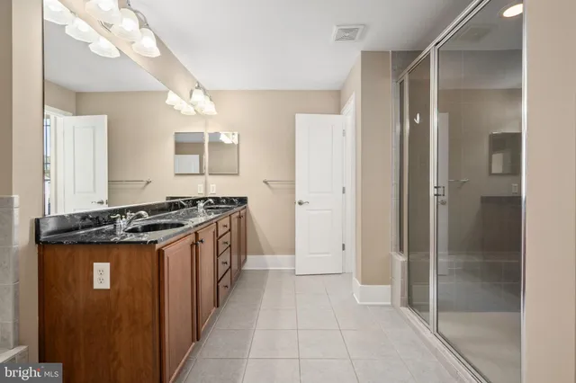 an aerial view of a swimming pool and lake