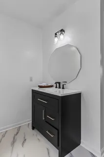 a bathroom with a sink and mirror