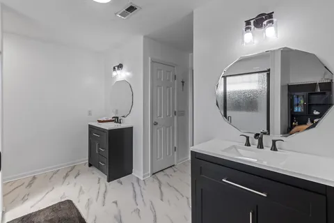 a bathroom with a sink and a mirror