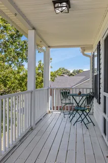 a view of a balcony with furniture
