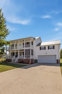 a front view of residential houses with yard