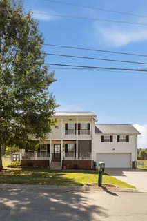a view of a swimming pool with outdoor seating
