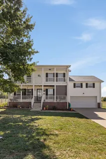 a view of a house with a swimming pool