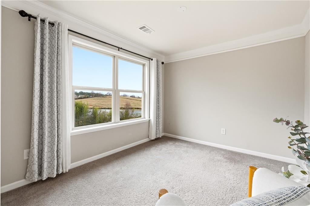 4735 Shiloh Valley Road Cumming, GA 30040 - Photo 14 of 39 a view of an empty room with a window
