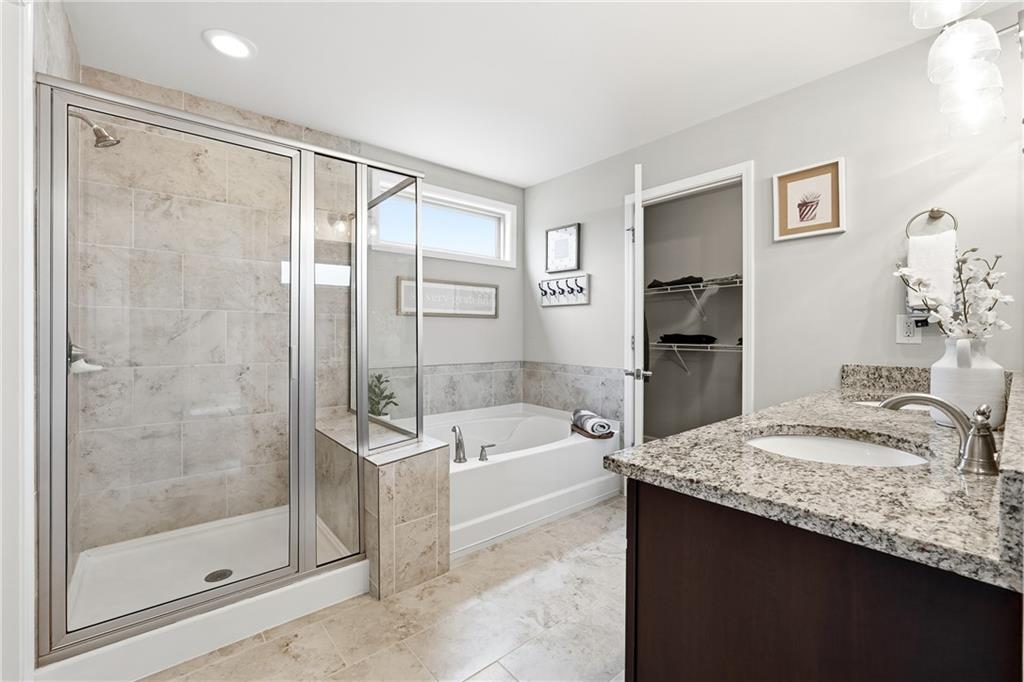 4735 Shiloh Valley Road Cumming, GA 30040 - Photo 15 of 39 a bathroom with a granite countertop sink a toilet and shower