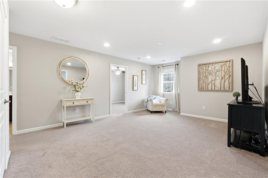 4735 Shiloh Valley Road Cumming, GA 30040 - Photo 19 of 39 a view of a livingroom with furniture and a workspace