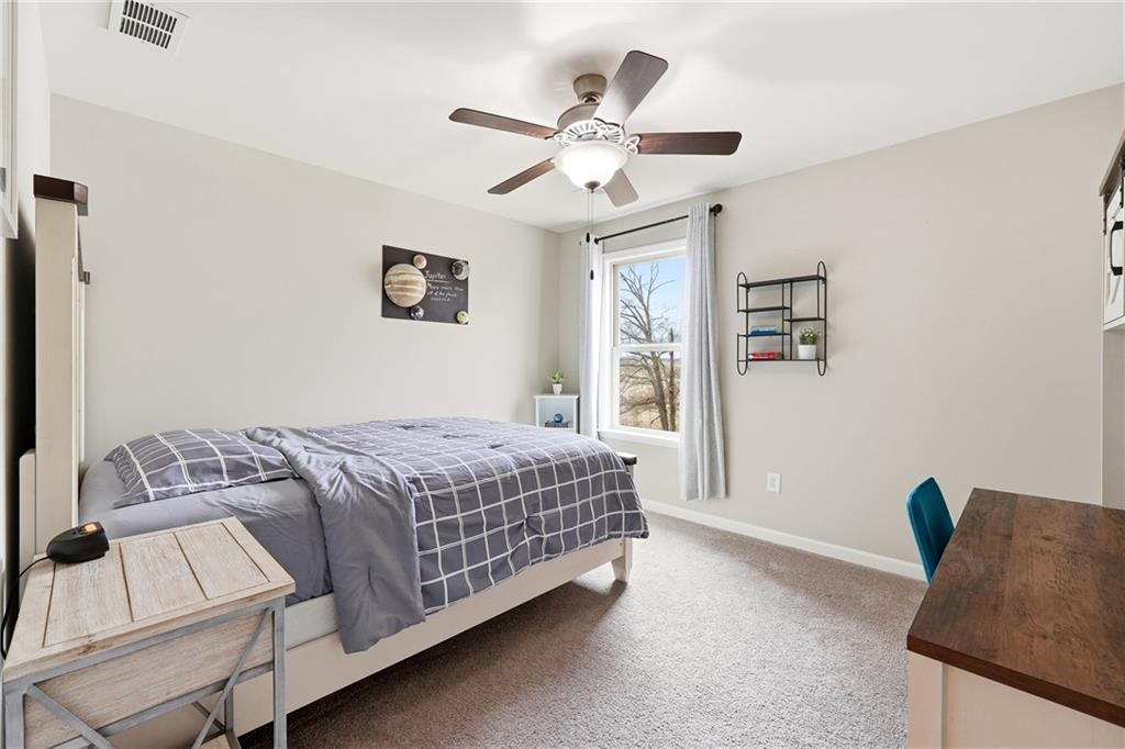 4735 Shiloh Valley Road Cumming, GA 30040 - Photo 20 of 39 a bedroom with a bed and window
