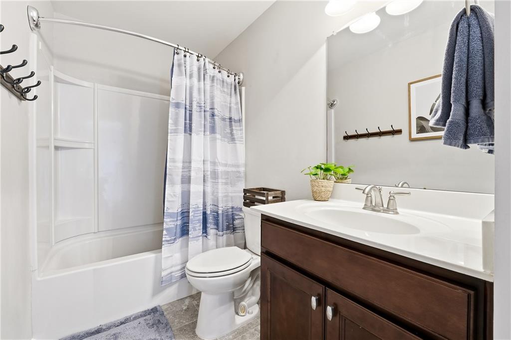 4735 Shiloh Valley Road Cumming, GA 30040 - Photo 24 of 39 a bathroom with a sink a toilet and shower