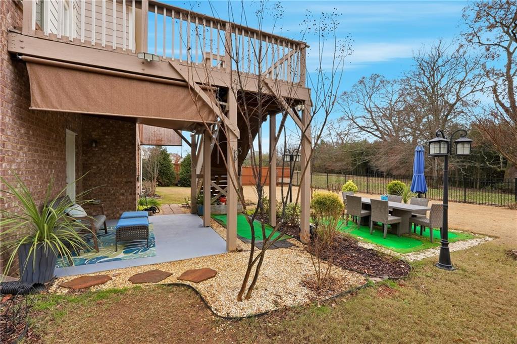 4735 Shiloh Valley Road Cumming, GA 30040 - Photo 28 of 39 a view of a house with backyard and sitting area