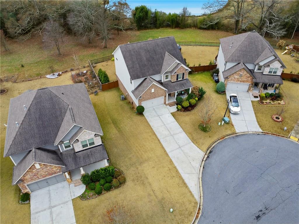 4735 Shiloh Valley Road Cumming, GA 30040 - Photo 31 of 39 an aerial view of a house with outdoor space and swimming pool