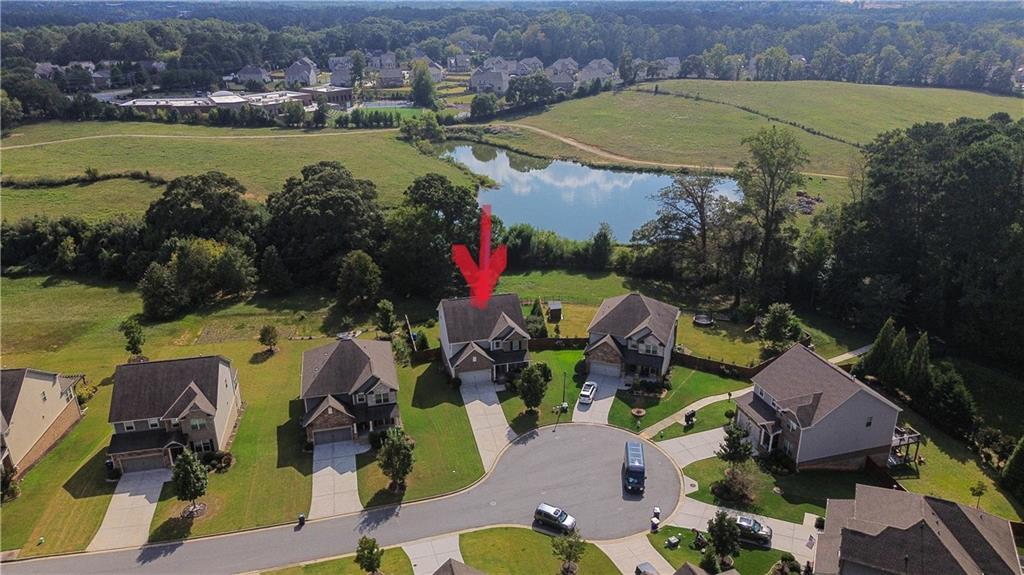 4735 Shiloh Valley Road Cumming, GA 30040 - Photo 36 of 39 an aerial view of a house with outdoor space and lake view